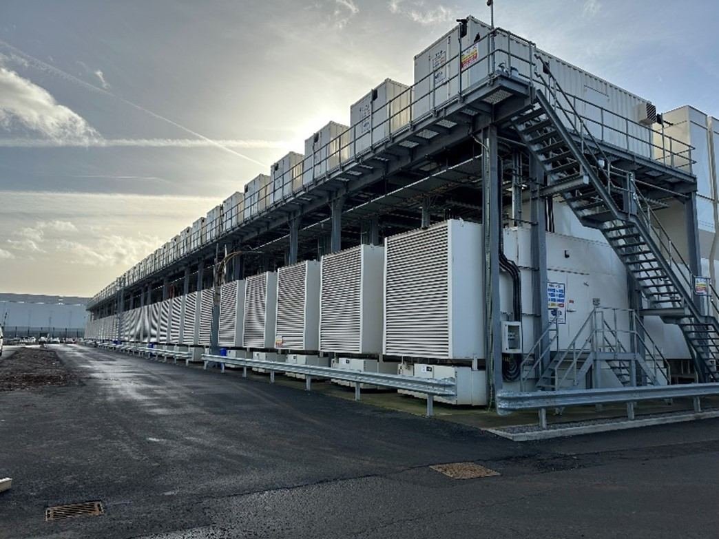 Aerial view of a large Powervault enclosure installation, rows of specialised enclosures with access walkways and stairs on site.